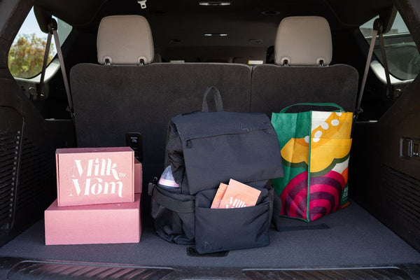Milk by Mom shipping kit and breast milk storage supplies packed in car trunk for travel, convenient freeze-dried breast milk service for busy moms on the go