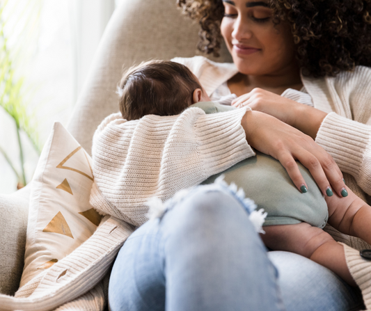 a mom breastfeeding her baby