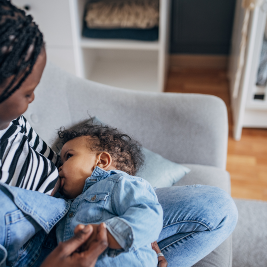 a mom breastfeeding her baby