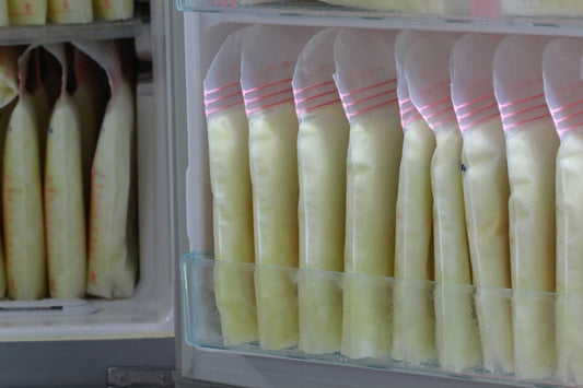 Frozen breast milk storage bags organized in a freezer, showing a stored breast milk stash for future baby feedings
