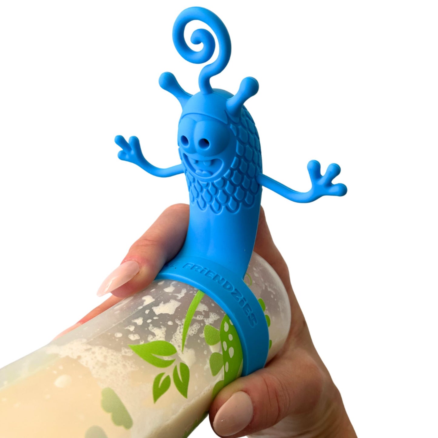 Hand holding a baby bottle filled with milk and topped with a playful blue bottle toy attachment designed to entertain babies during feeding